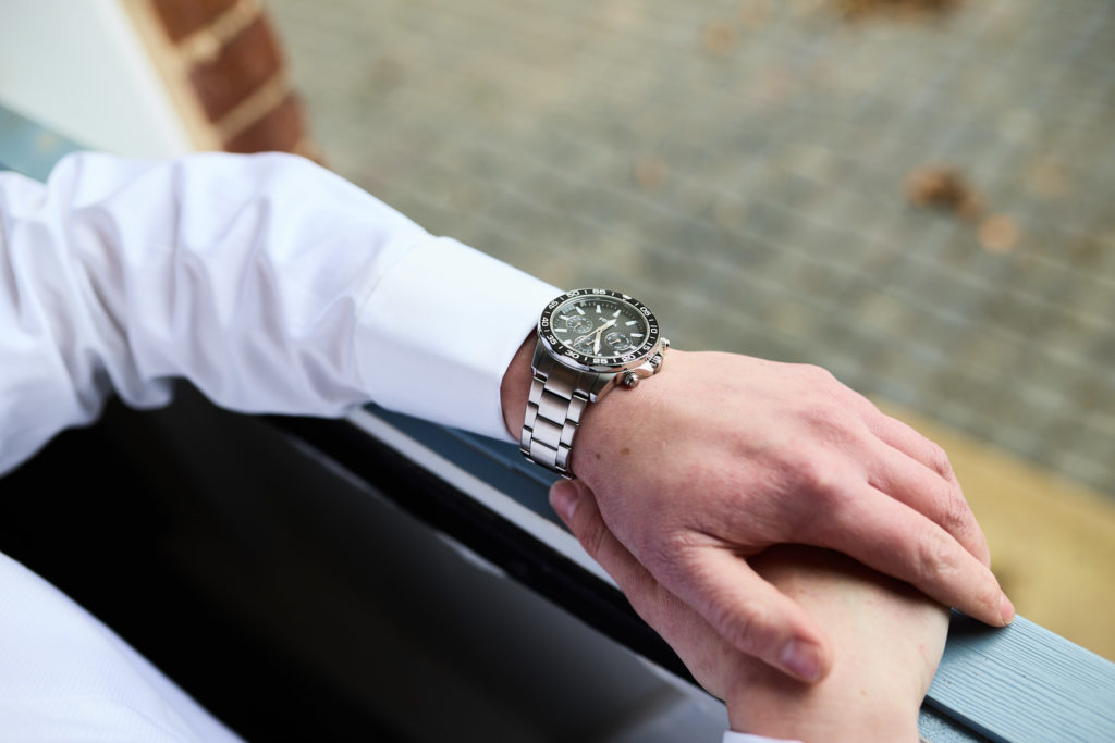 Close-up of the groom's watch and shirt cuff