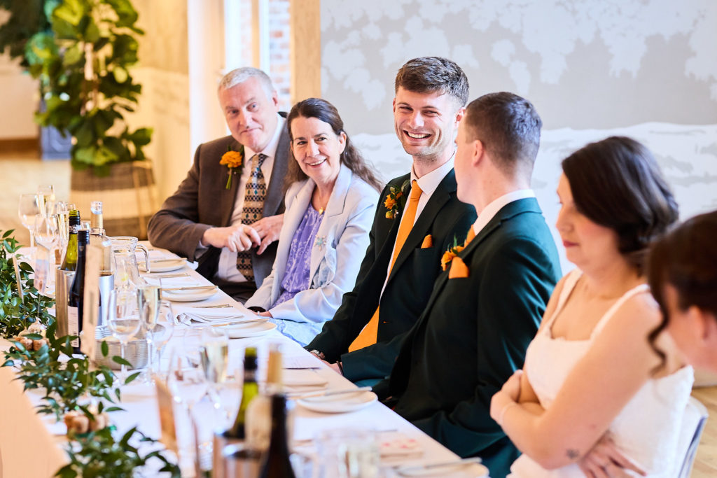 Guests along the top table listening to the speeches