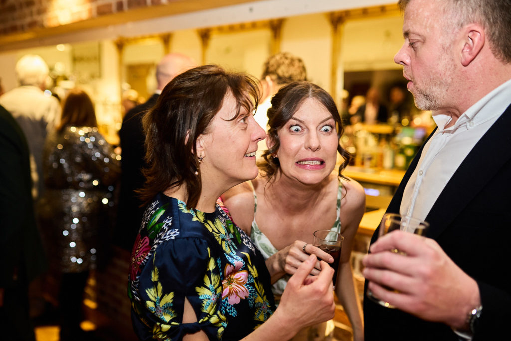 Wedding guests chatting at the evening reception