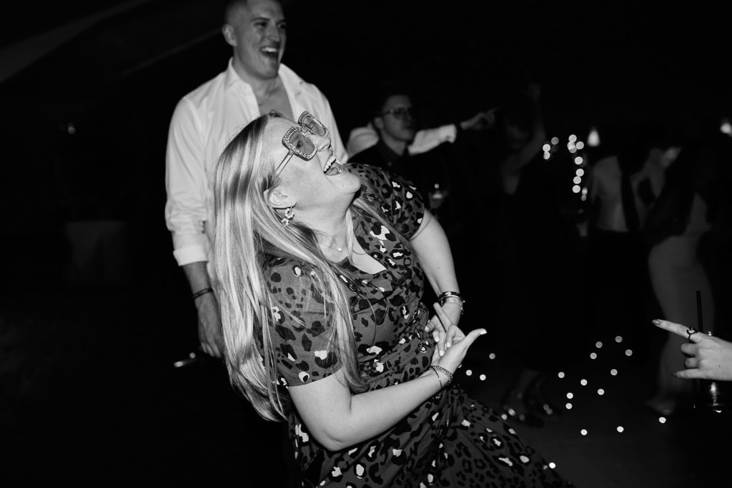 Black and white photo of a couple dancing at the evening reception