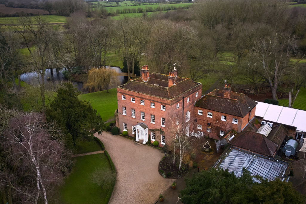 Aerial drone photo of Mulberry House, a red-brick Georgian wedding venue in Essex