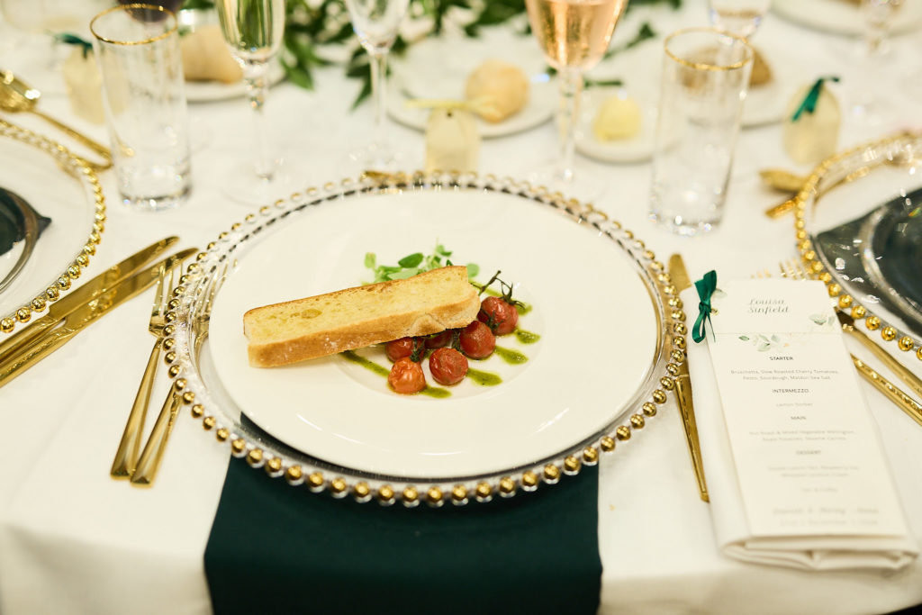 Dessert served on a gold-rimmed plate at the wedding breakfast