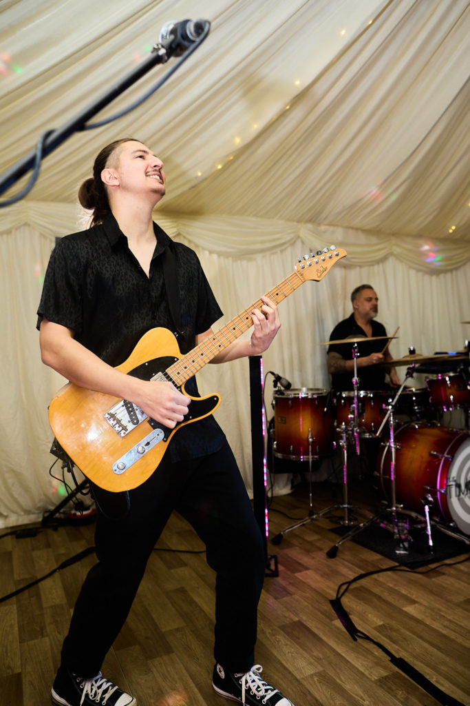 Guitarist performing with the wedding band