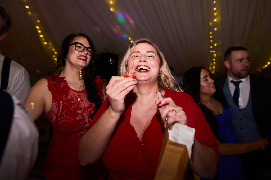 Wedding guests laughing on the dance floor