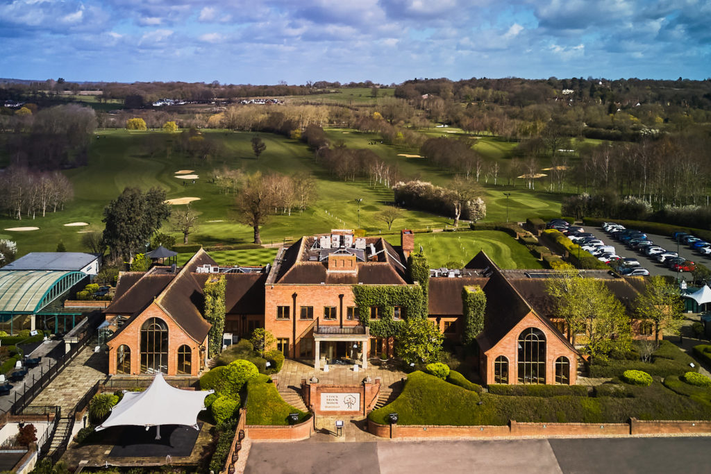 Aerial drone photo of Stock Brook Manor and its golf course in the Essex countryside