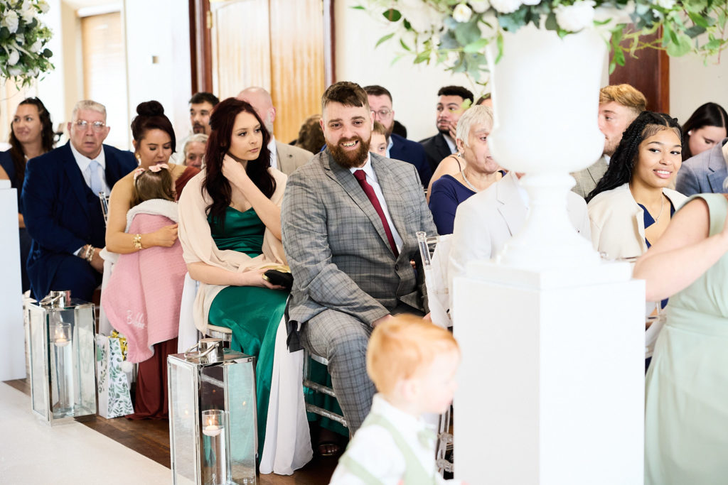 Wedding guests seated and waiting for the ceremony to begin