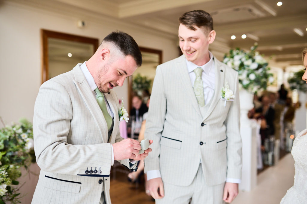 Groom and best man waiting at the front as the ceremony begins