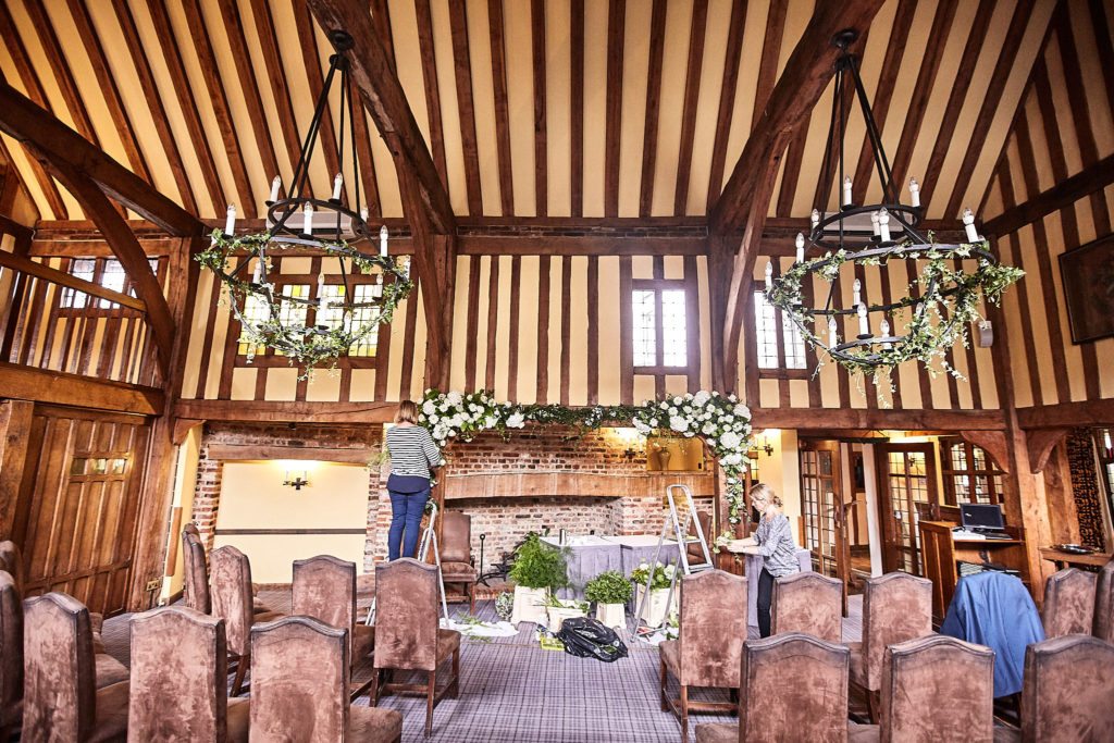 Timber-framed ceremony room at The Swan at Lavenham being set up for the wedding