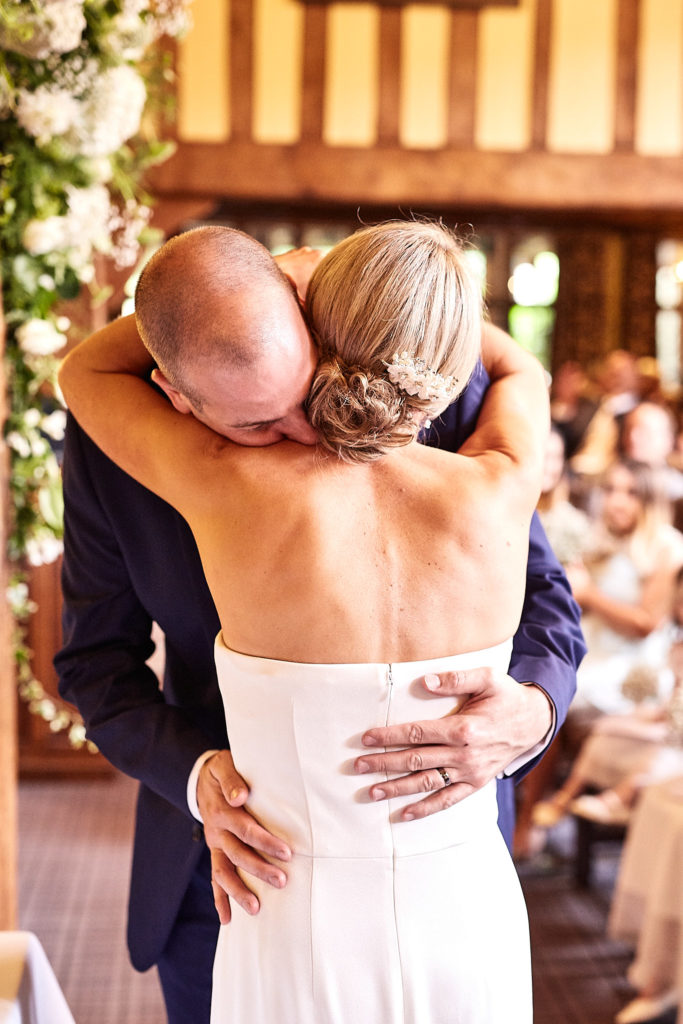 Bride and groom hugging after the ceremony