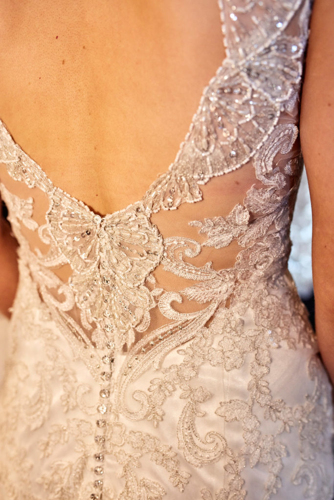 Close-up of the beaded lace back of the wedding dress