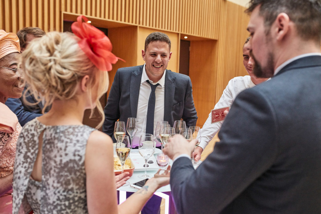 Wedding guests laughing at the table