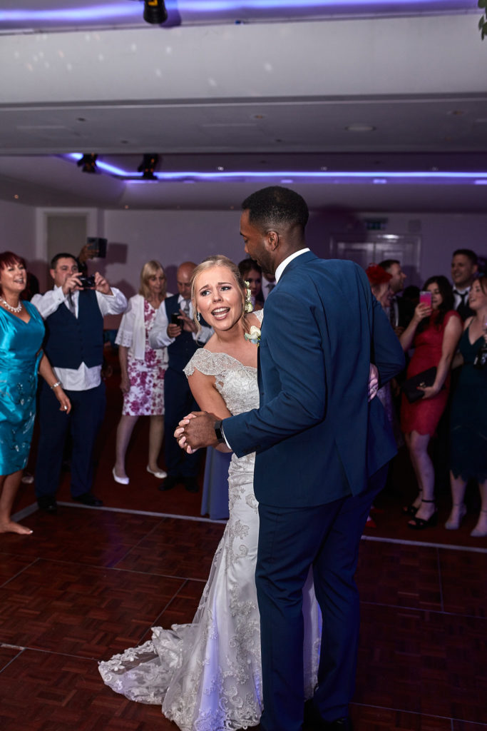 Bride and groom's first dance surrounded by guests at the Andaz