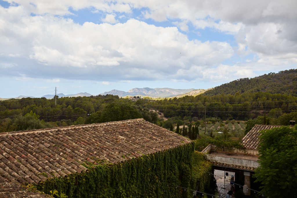 Terracotta rooftops and wooded hills in Mallorca