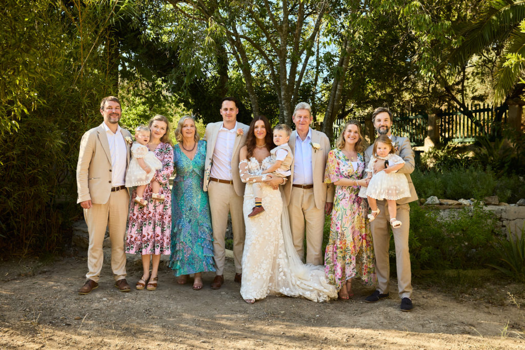 Bride and groom with their families in the gardens at Son Boronat