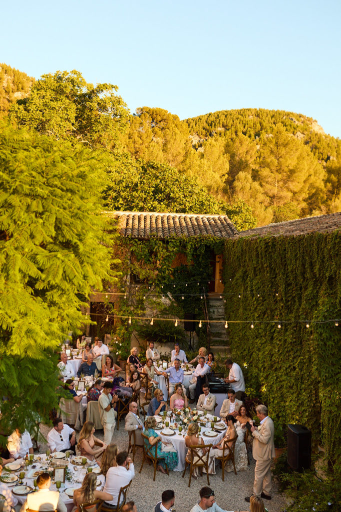 Wedding dinner in the ivy-walled courtyard at Son Boronat, seen from above