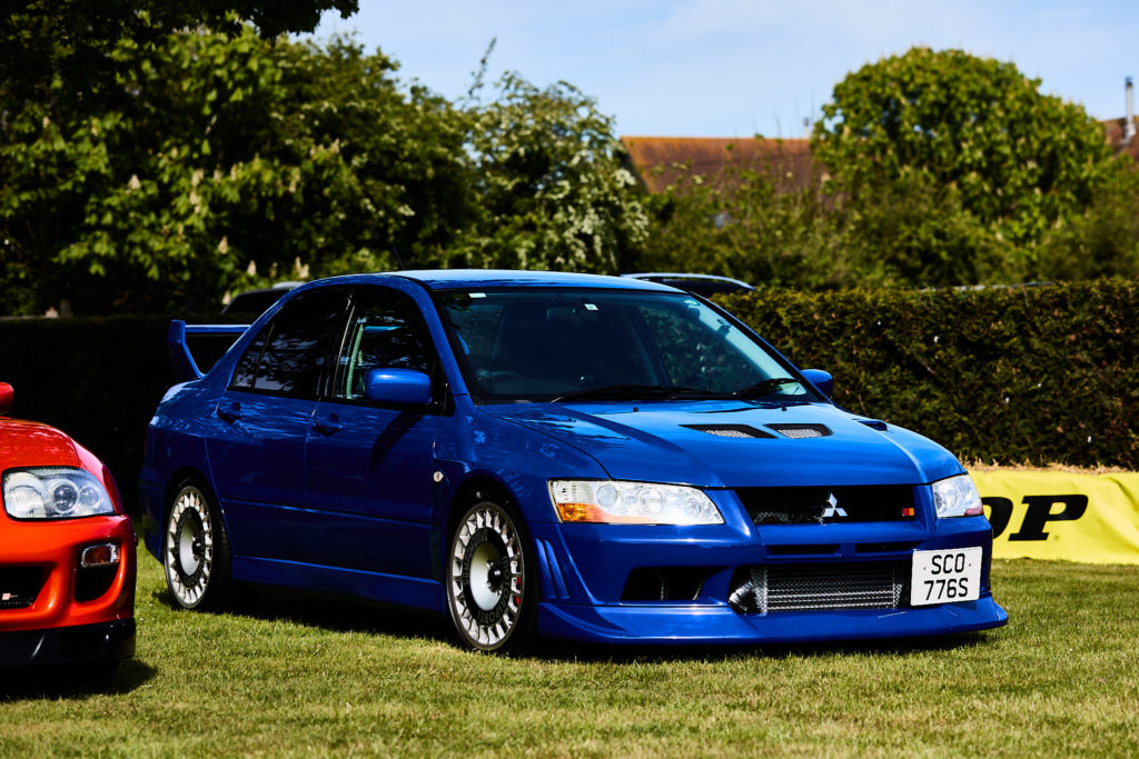 Blue Mitsubishi saloon parked on the grass at the wedding car show
