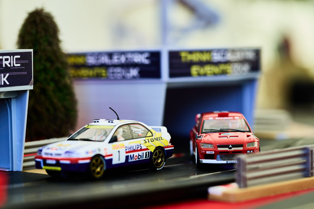 Toy rally cars on a Scalextric track at the wedding reception
