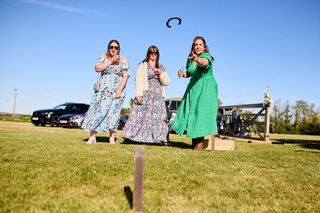 Three women playing garden games on the lawn