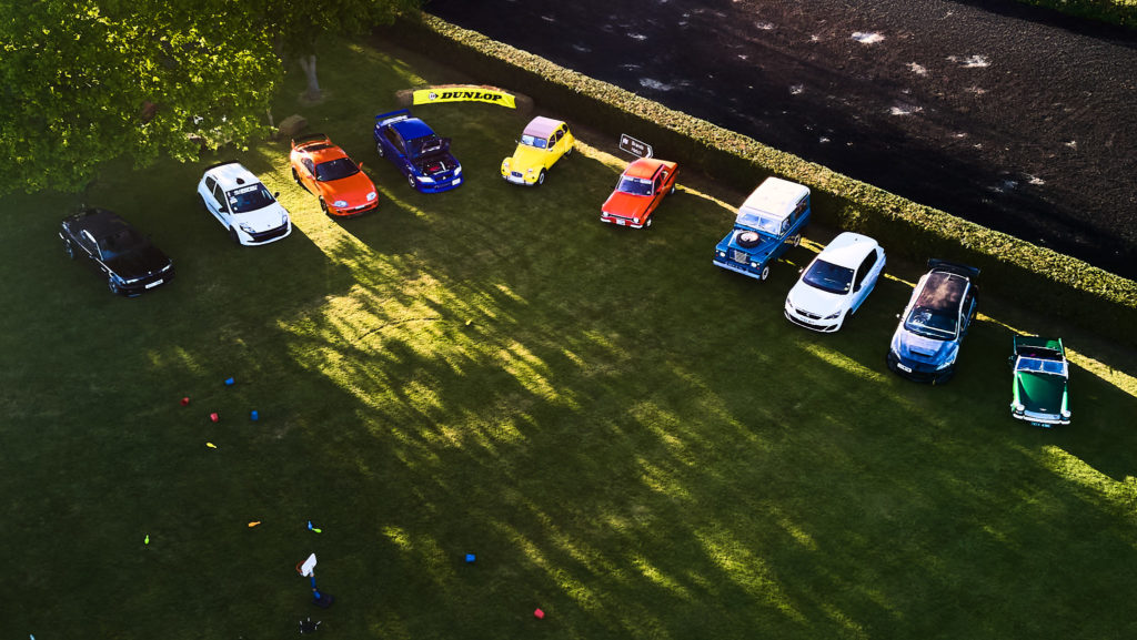 Aerial drone photo of cars lined up on the grass at the wedding car show in South Fambridge