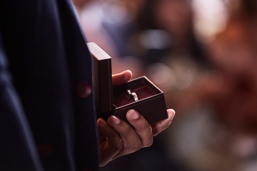 Close-up of the wedding rings held in their box during the ceremony
