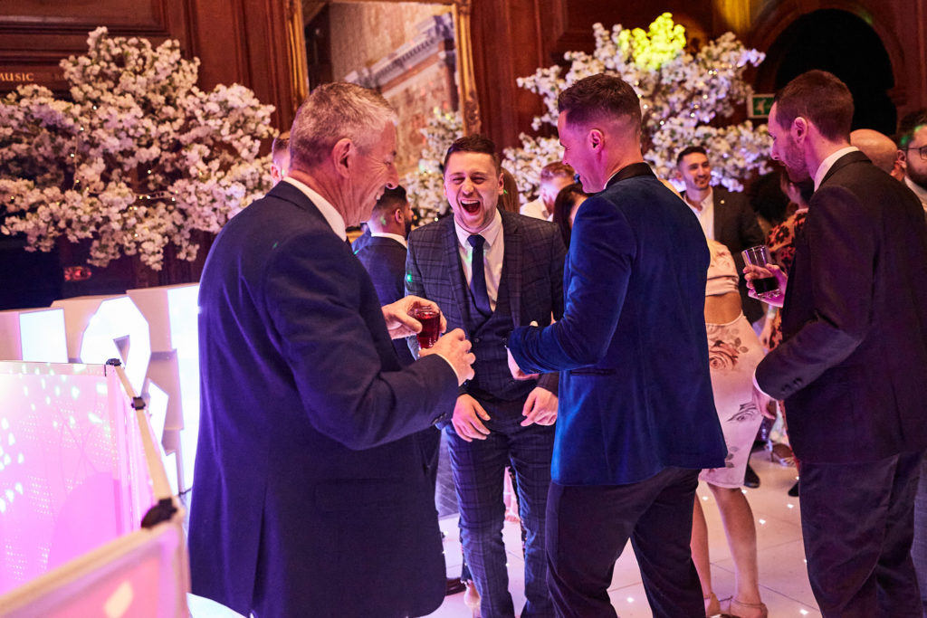 Groom greeting guests on the dance floor
