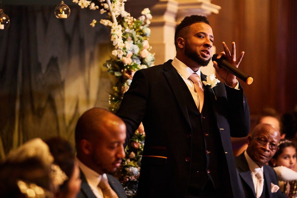 Best man giving his speech with a microphone