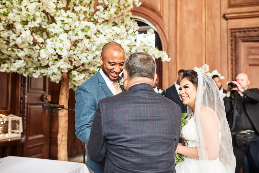Groom greeting the man who walked the bride down the aisle
