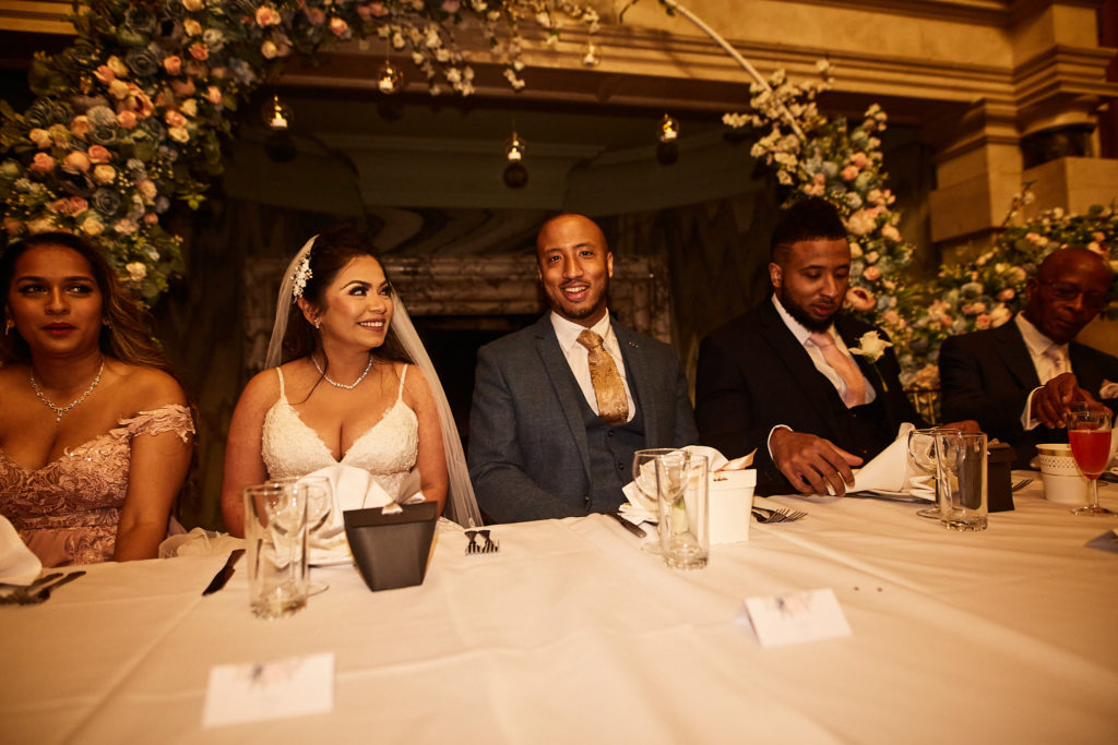 Bride and groom at the top table with their wedding party