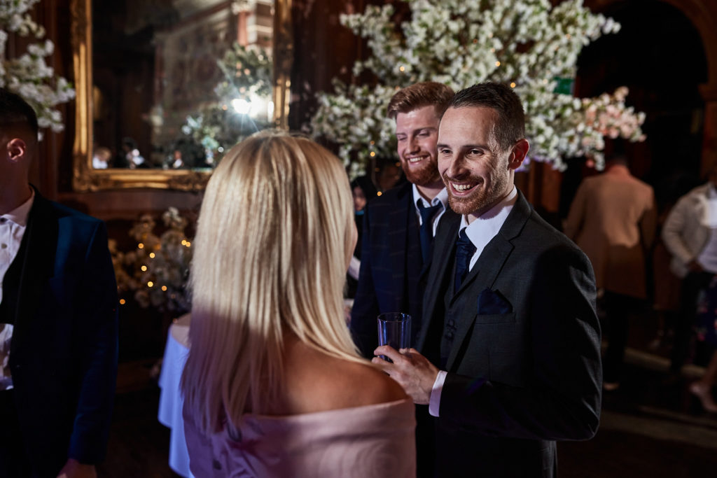 Wedding guests chatting at the drinks reception