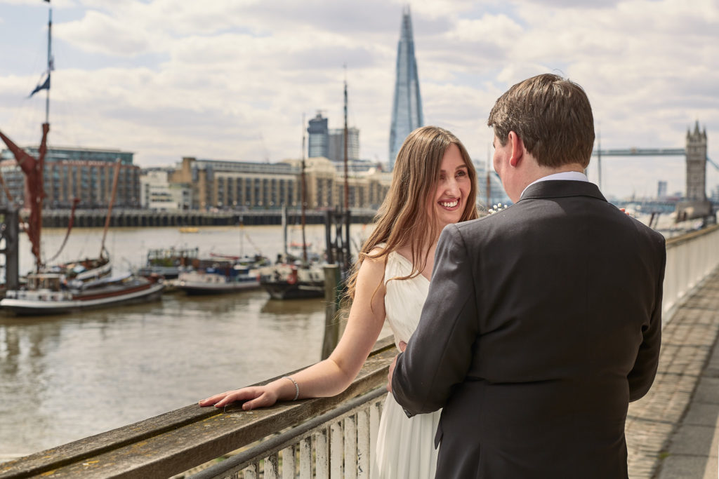 Bride and groom beside the River Thames with the Shard behind them