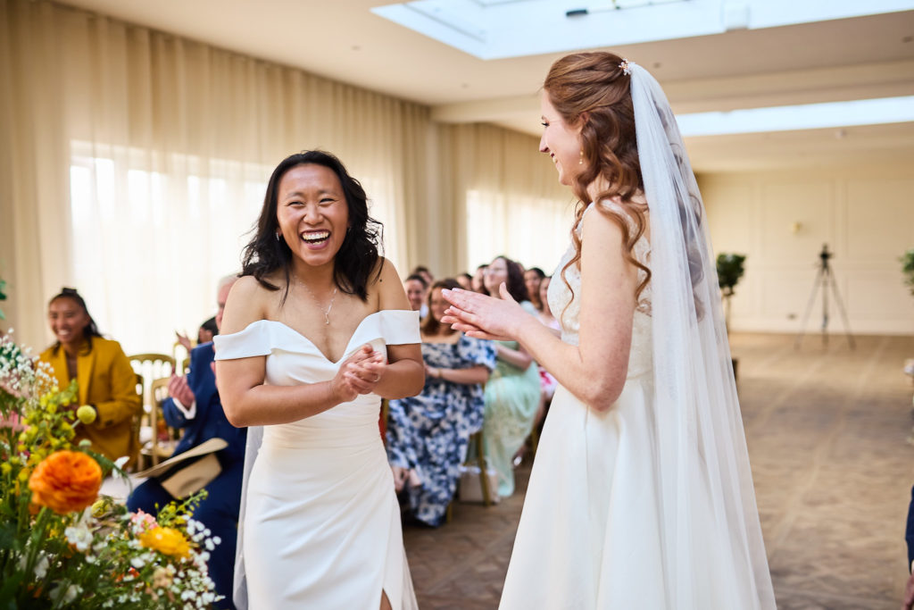 Bride laughing during the exchange of vows