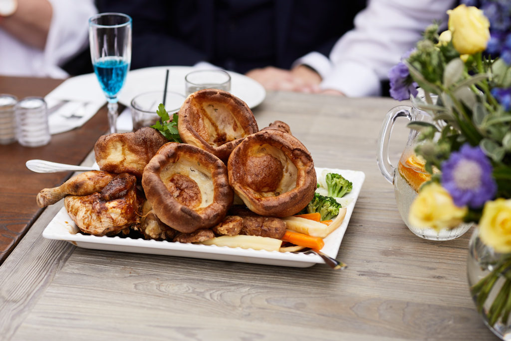 Plate of Yorkshire puddings on the table at the wedding breakfast