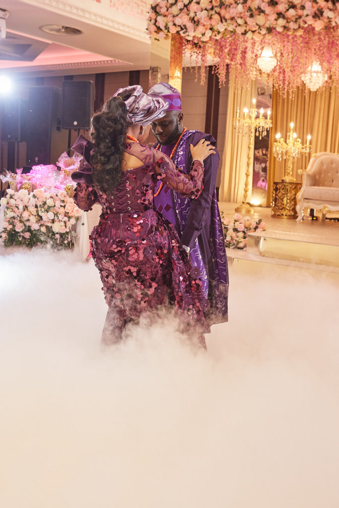 Bride and groom dancing in a cloud of dry ice on the dance floor