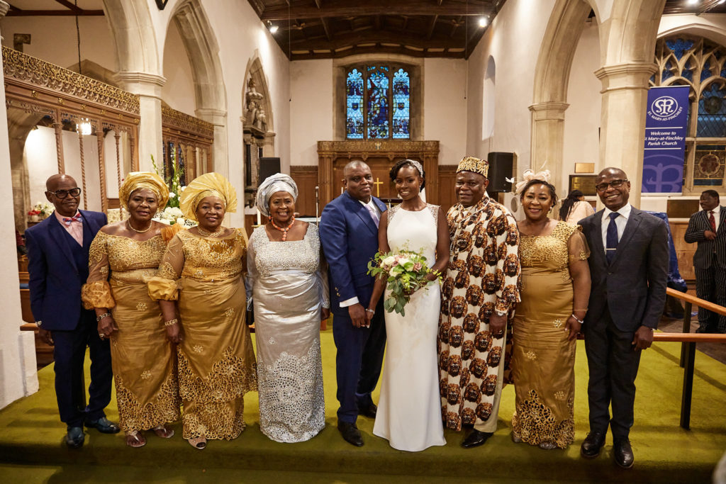 Bride and groom with their families at the front of the church
