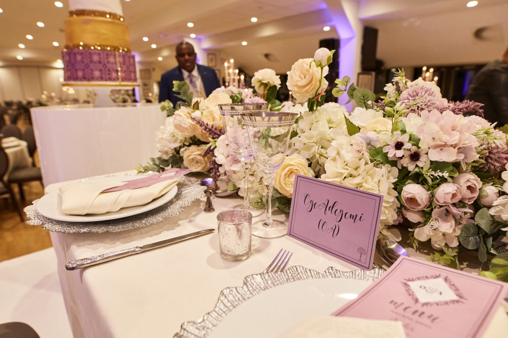 Top table with lilac flowers and purple stationery