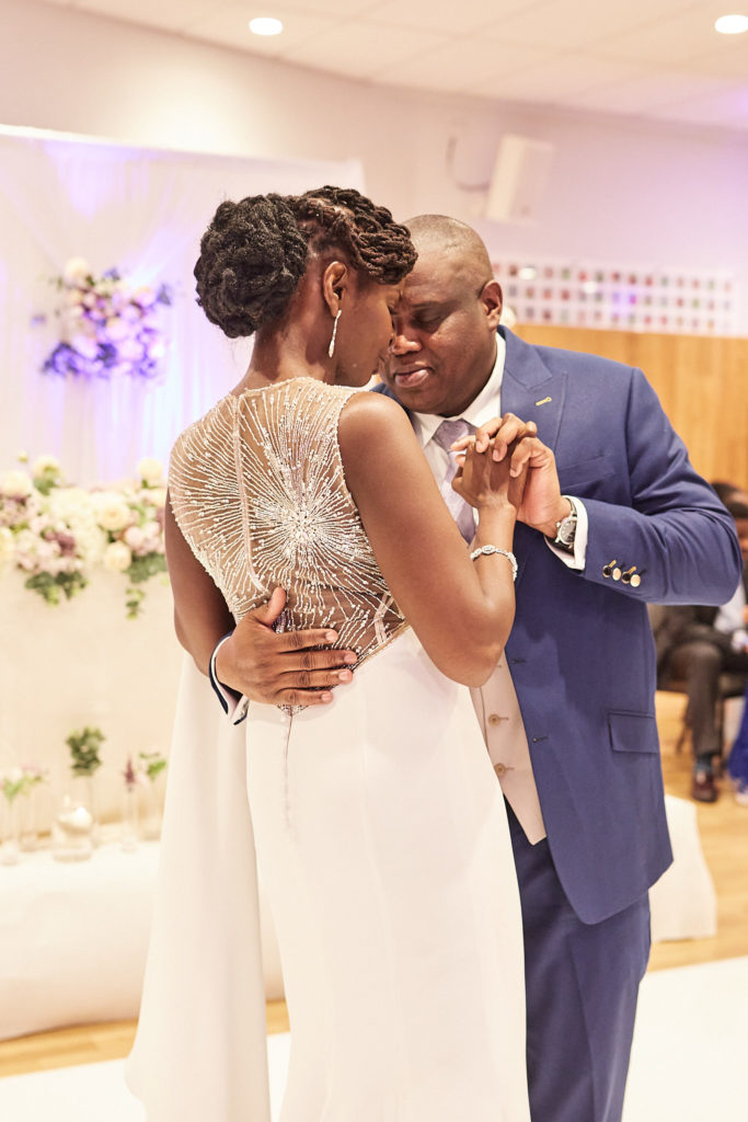 Bride and groom's first dance, showing the beaded back of her dress