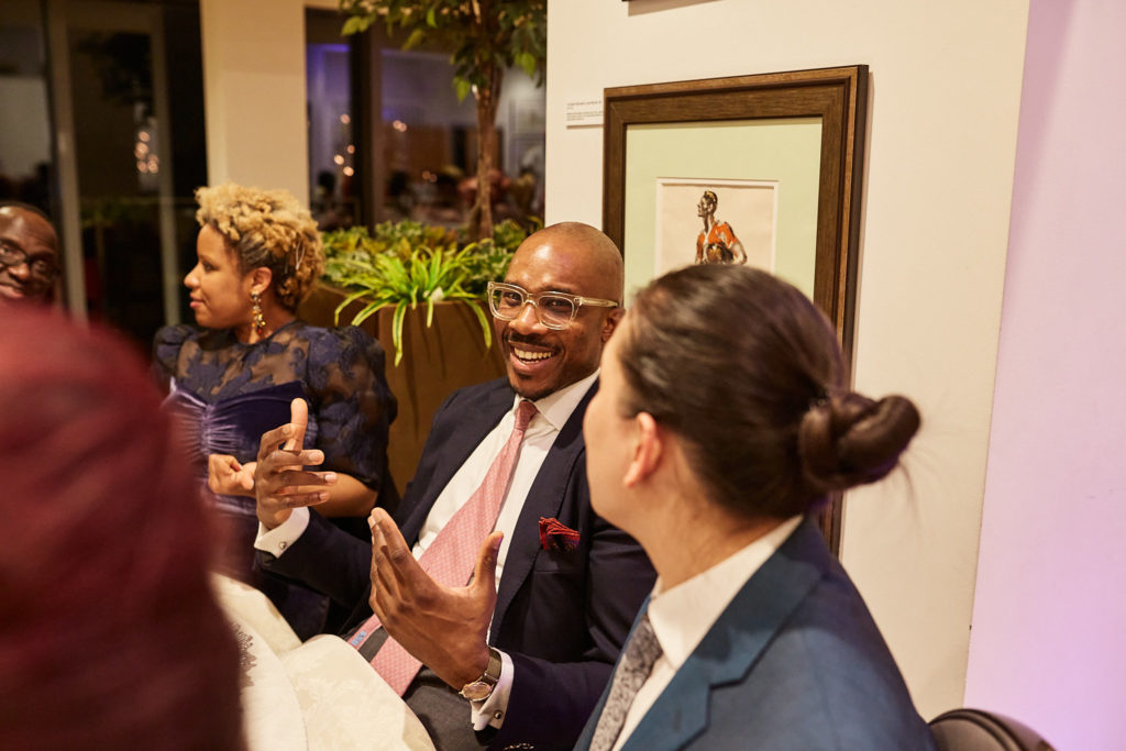 Wedding guests chatting at the reception