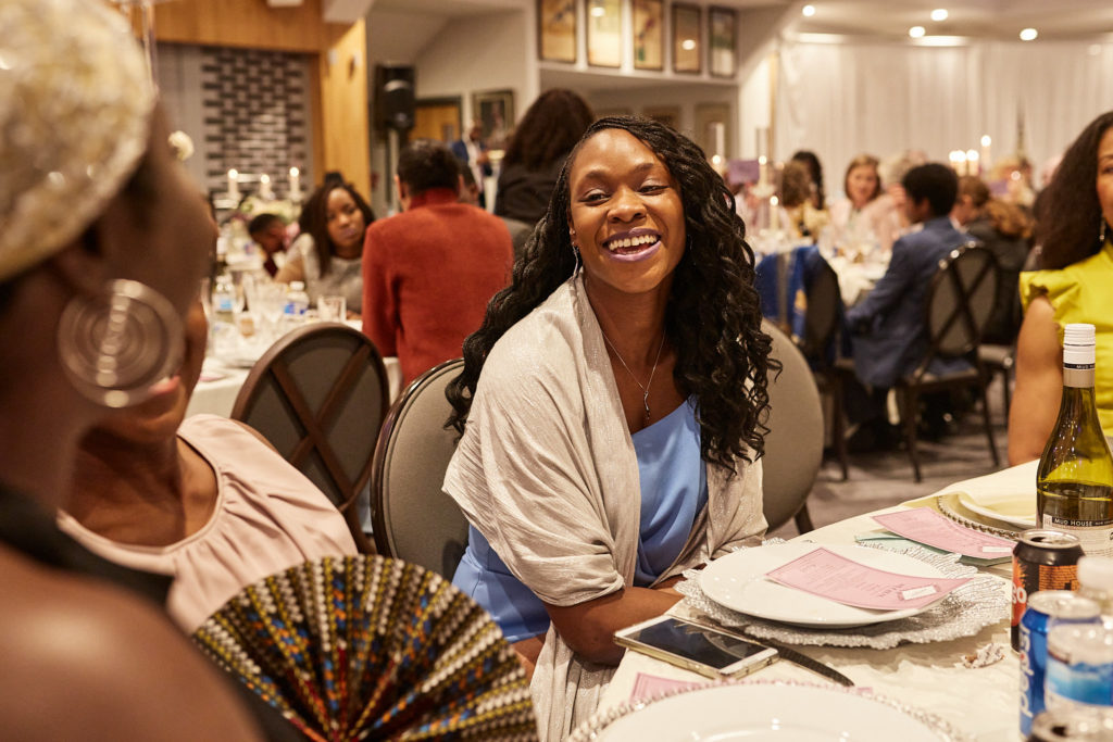 Wedding guest laughing at the table