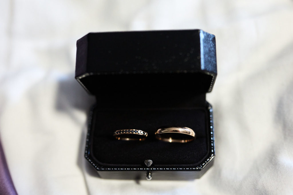 Wedding rings in a navy ring box